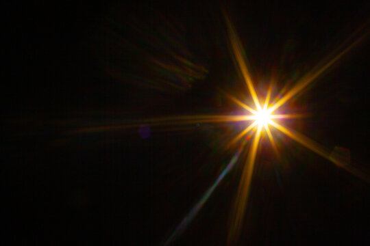 Sun flare on the black background