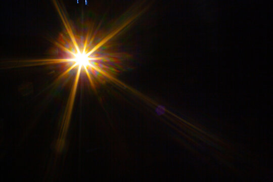 Sun flare on the black background