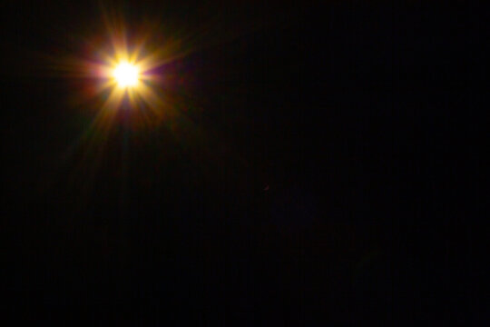 Sun flare on the black background
