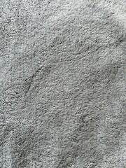 Soft grey fleece fabric texture background close up © Mateusz