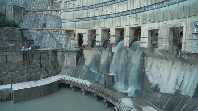 Enguri Hydropower Plant spillway releasing water through concrete dam, Georgia renewable energy infrastructure for hydroelectric generation and water management.