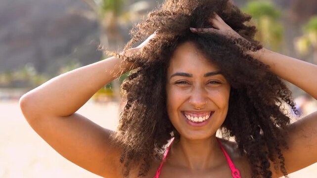 Happy young african woman enjoy summer day on the beach - Vacation, holiday and travel concept	