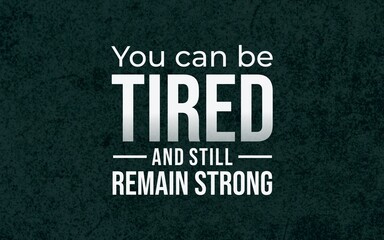 Compassionate motivational typography affirming that tiredness can coexist with strength, shown in clean white lettering on a dark green textured background. © DaffinArt