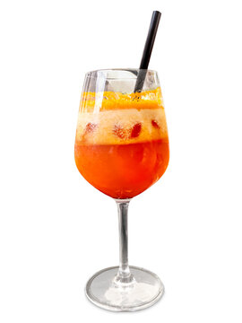 Refreshing non alcoholic orange fruit cocktail with ice cubes and foam served in elegant stemmed glass isolated on white with clipping path, with a straw, healthy summer beverage concept.