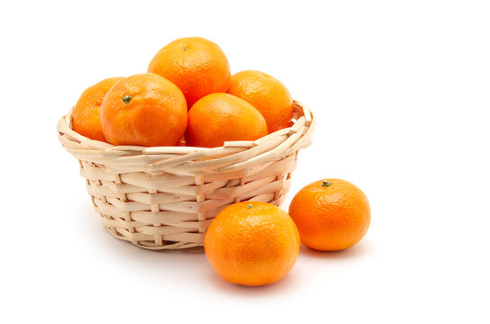 Mandarin in basket isolated on white