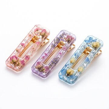 Handmade resin hair clips with dried flowers, botanical epoxy barrettes in pink purple and blue, aesthetic floral hair accessories for women