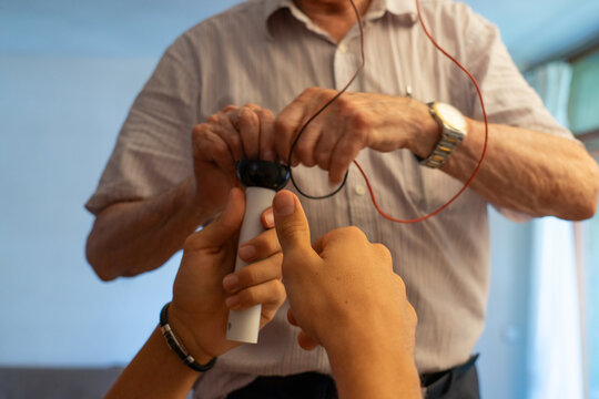 Installation of a Ceiling Lamp with Teamwork During a Home Repair