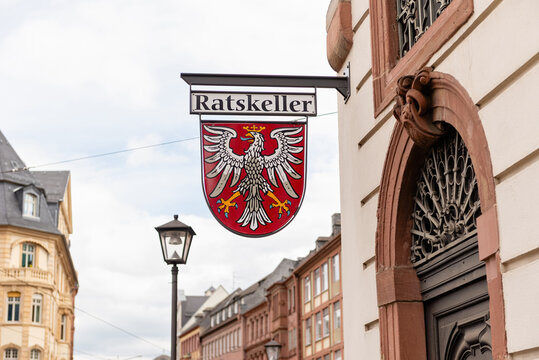 FRANKFURT AM MAIN, GERMANY - APRIL 4, 2026: A hanging signboard of the Ratskeller restaurant featuring the coat of arms eagle of Frankfurt am Main on a city street