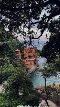 Gimbal shot of Portofino coastal town scenery with historic houses, Liguria, Italy
