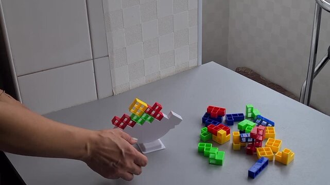 Creative stacking of colorful blocks on a table indoors
