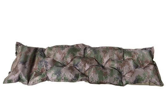 Camouflage inflatable sleeping pad isolated on white background. Portable camping sleeping mat with built-in pillow for outdoor hiking and military gear