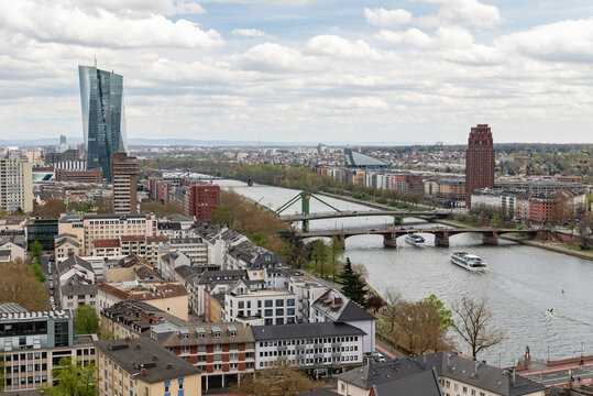 FRANKFURT AM MAIN, GERMANY - APRIL 4, 2026: Cityscape panorama from the tower of Kaiserdom St Bartholomaeus cathedral featuring the Flosserbruecke and Alte Bruecke bridges over the Main river