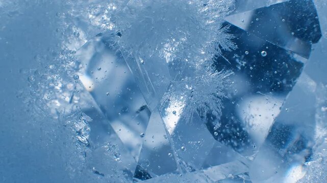 Abstract Macro View of Fractured Blue Ice Texture with Delicate Frost Crystals and Trapped Air Bubbles, Highlighting the Cold Winter Environment.