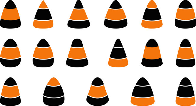 A collection of orange and black candy corn pieces arranged in rows on a white background