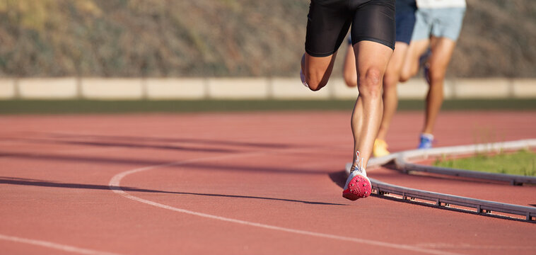 Athletics people running on the track field.Running a race on a track for sports competition and winning