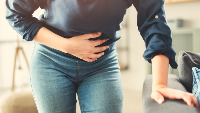 Young woman with stomach ache