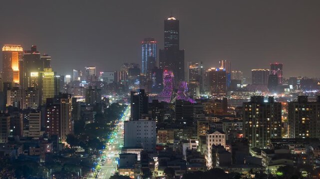 Kaohsiung City timelapse showing its futuristic skyline at night in southern Taiwan, zooming in.