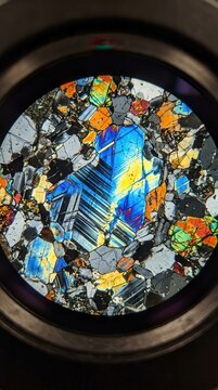 Stunning Microscopic View of Crystalline Rock Thin Section Under Polarized Light