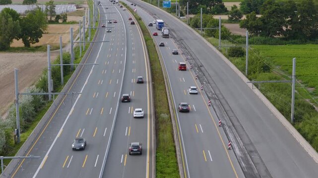Aerial view of Teststrecke Oberleitung fur LKW with trucks and cars on the highway in Weiterstadt, Hessen, Germany.