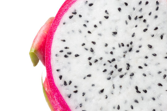 close up of cut of ripe pitahaya fruit isolated on white