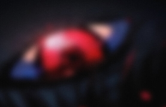 Blurry red and white abstract light shapes