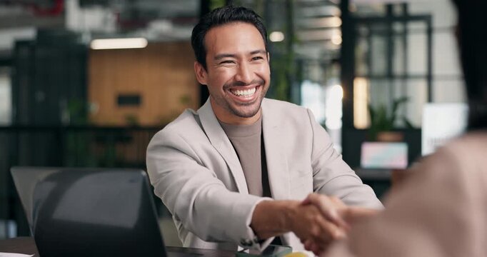 Interview, man and happy with handshake in office for internal vacancy, new recruit and welcome. Company growth, HR manager and candidate shaking hands for job promotion, contract renewal and laugh