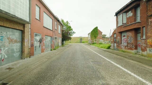 POV walk through abandoned ghost town Doel with graffiti, deserted buildings and silent streets - Antwerpen, Belgium