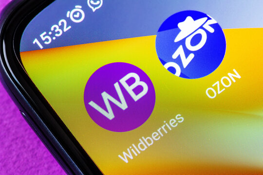 Adygea, Russia - August 13, 2023: Close-up of a smartphone screen showing Wildberries and Ozon shopping app icons on a colorful mobile interface with visible display pixels and device bezel