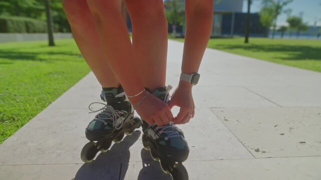 A Rollerblader's Journey: Tying Skates for a Fun Day on the Pavement in a Sunny Park Setting, where Movement Meets Nature and Excitement Awaits.
