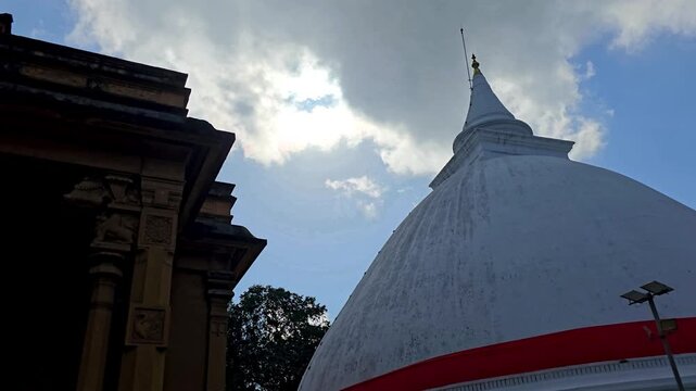 Wide view of the stupa and shrine room at Kelaniya Raja Maha Viharaya in Sri Lanka, one of the country's most sacred Buddhist temples associated with Lord Buddha's final visit. 4K