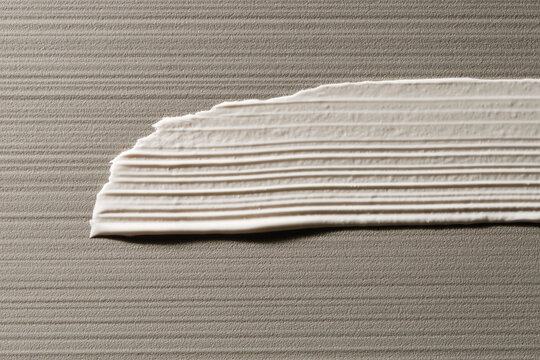 An abstract representation of creamy textured material effectively captures the nuanced surface that invites a sense of tactile engagement and visual identity in art.