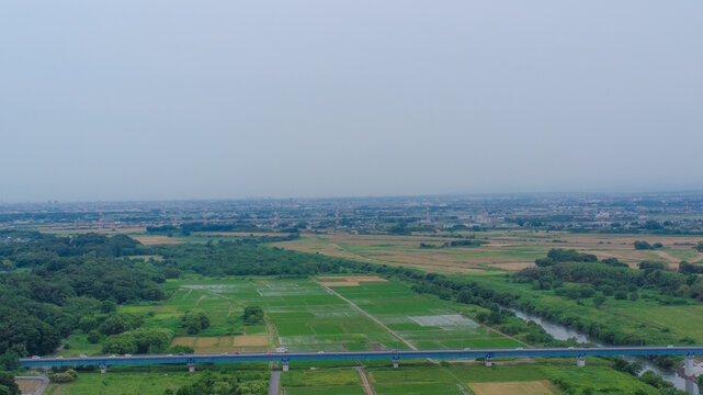Aerial view of the Kanto Plain and farmland seen from above a river in Japan