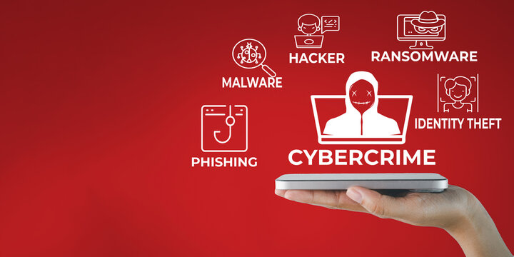 Cybercrime and cybersecurity concept. Hand holding a smartphone displaying white graphic icons for phishing, malware, ransomware, hacker and identity theft on a red background with copy space.