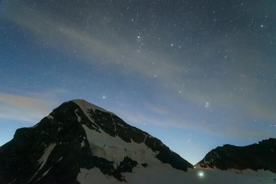 Starry night sky timelapse over Alpine sunrise