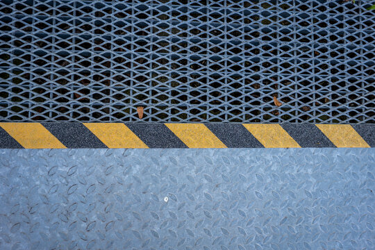 Industrial Metal Mesh and Diamond Plate with Yellow and Black Hazard Stripes