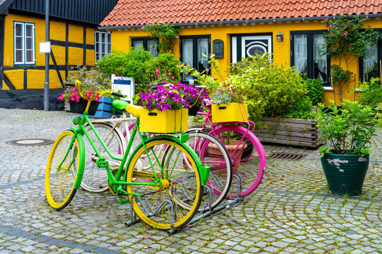 Kappeln, Germany &ndash; Colorful bicycles with flowers in front of historic half timbered houses