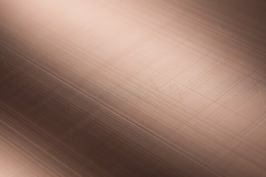 Polished Rose Gold Copper Metallic Surface with Diagonal Light and Brushed Texture Detail