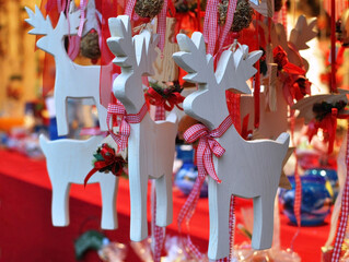 Christmas Wooden deer decorations at a Christmas market © Halina