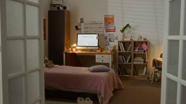 Computer monitor displaying geometry quiz standing on desk in empty teenager bedroom. Footage is ideal for online education promos and e-learning advertisements