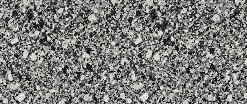 Granite rock texture featuring a dense aggregate of fine black biotite spots and small white crystalline feldspar grains creates a solid abstract backdrop for architectural designs