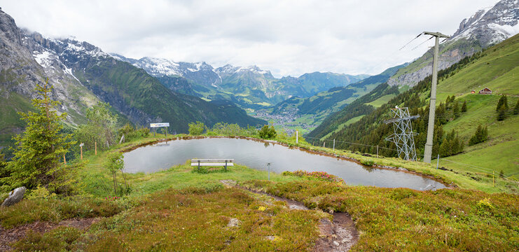 panoramaseeli pond with bench beside, alpine landscape furenalp engelberg, switzerland