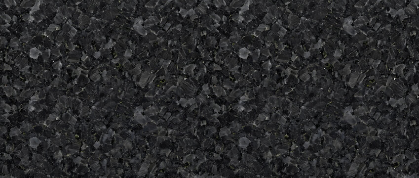 Granite rock texture featuring a dense aggregate of deep black mineral matrix and iridescent dark labradorite crystal flakes creates a solid natural abstract backdrop for premium architectural designs