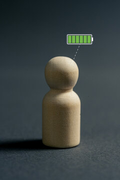 Fully charged person with maximum energy level and motivation represented by full battery icon