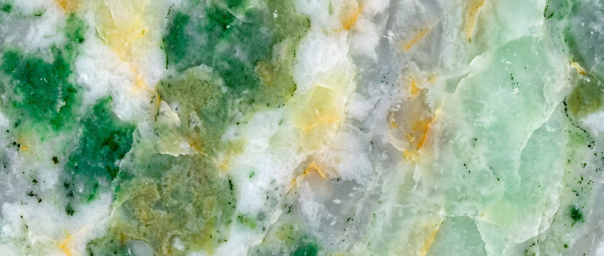Marble texture featuring a spectacular blend of light green onyx stone layers with vibrant emerald veins and golden fractures creates an elegant luxury backdrop for modern upscale branding designs