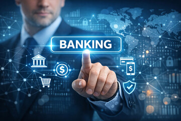 Obraz premium A corporate businessman in suit and tie pointing at the word 'BANKING' on a holographic interface representing digital banking and finance technology.