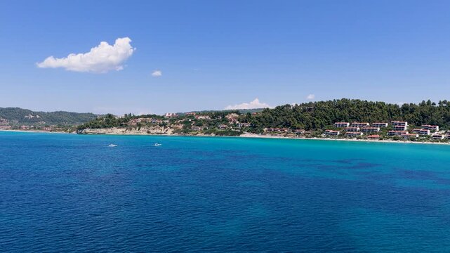 Possidi West Beach Greece turquoise sea and resort hillside