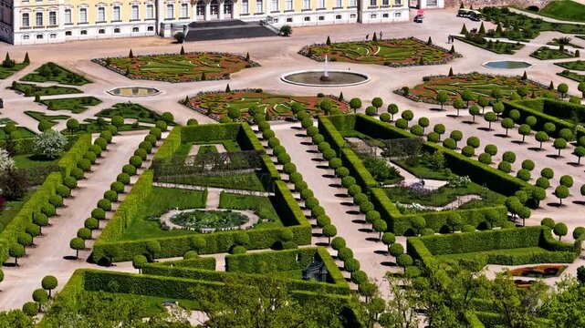 Rundale, Latvia - 29 May 2025: Aerial view of the formal baroque gardens with manicured hedges, geometric paths, and fountains.