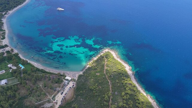 Glarokavos Beach blue cove pine headland coastal sea aerial view