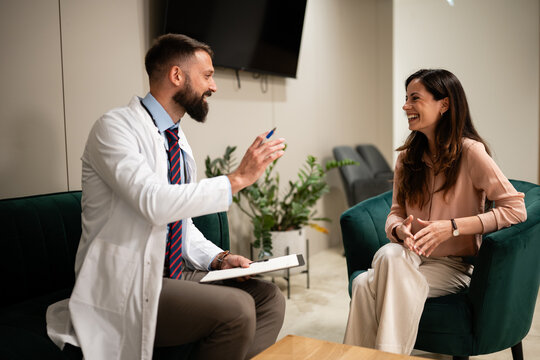 Doctor discussing treatment plan with smiling patient