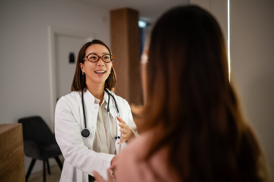 Doctor discussing health with patient during medical consultation